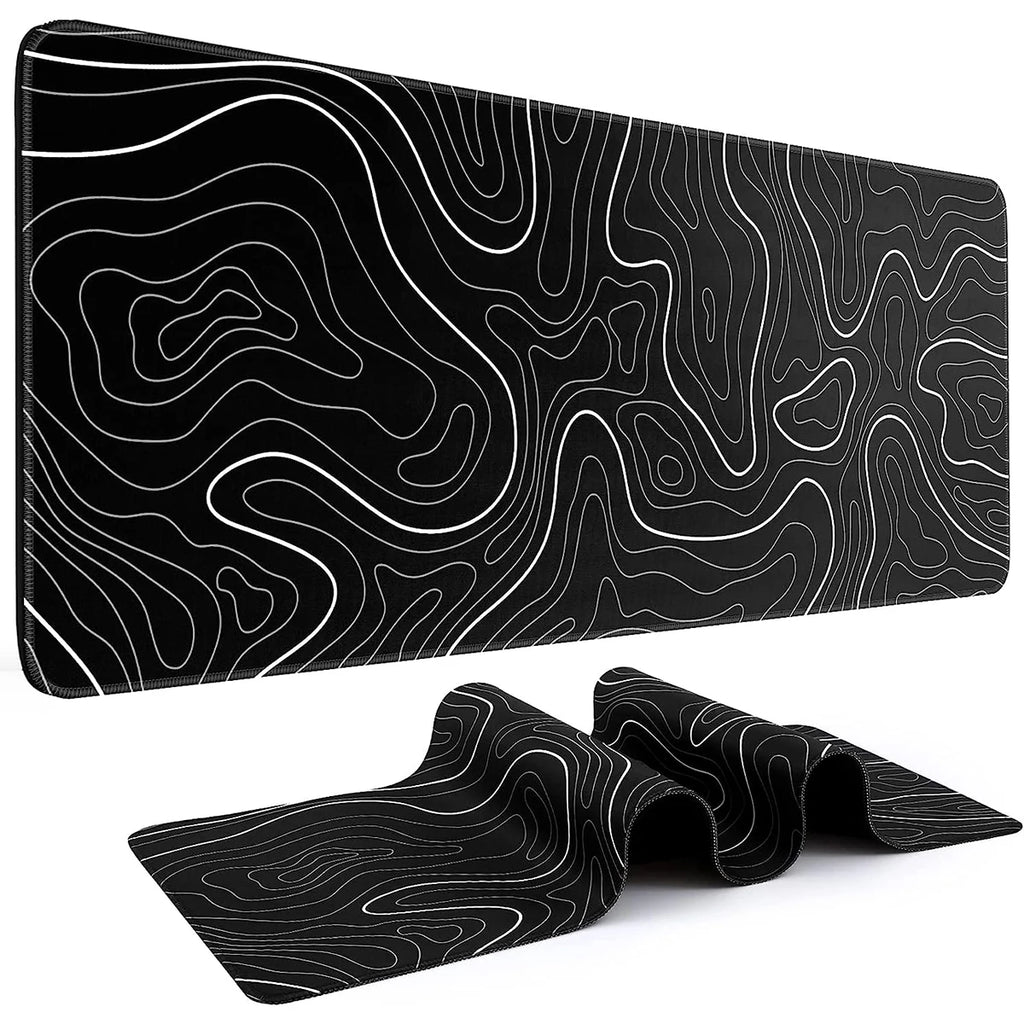 Black desk mat with white topographic line pattern, extended mouse pad design